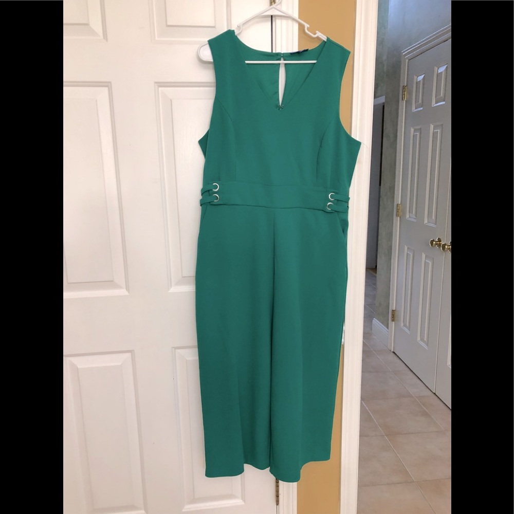 Woman’s jump suit in green.